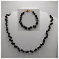Glasparels sieraden set zwart goud - ketting en armband